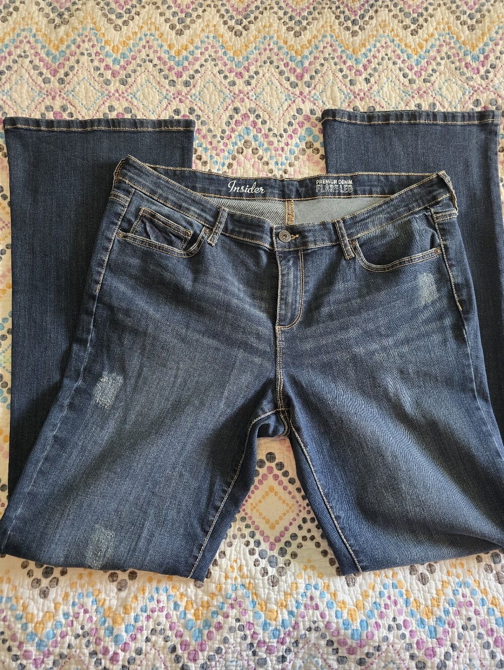 Insider brand distressed Lg flared denim jeans.